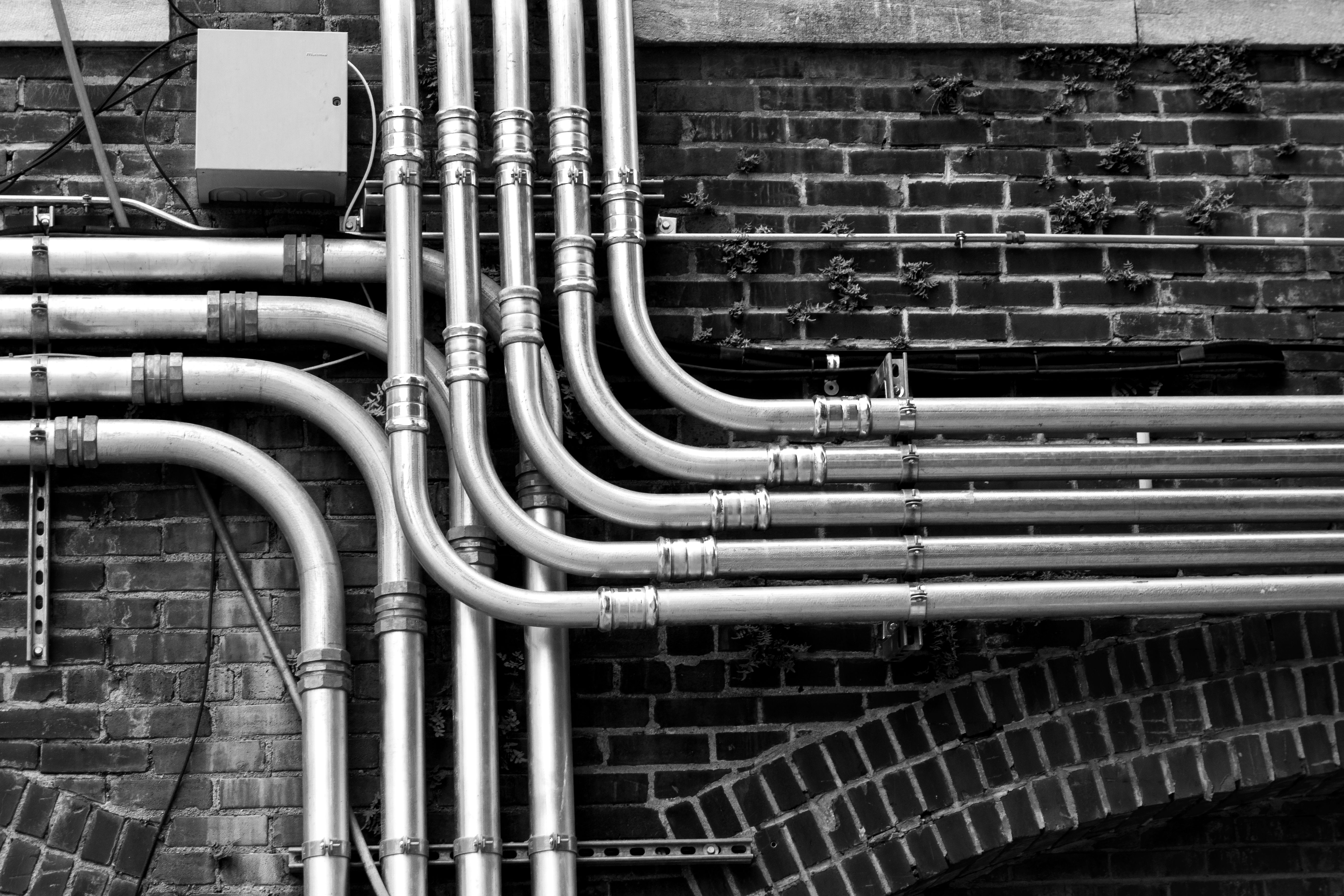 ClearFlow plumber working on a pipe fitting